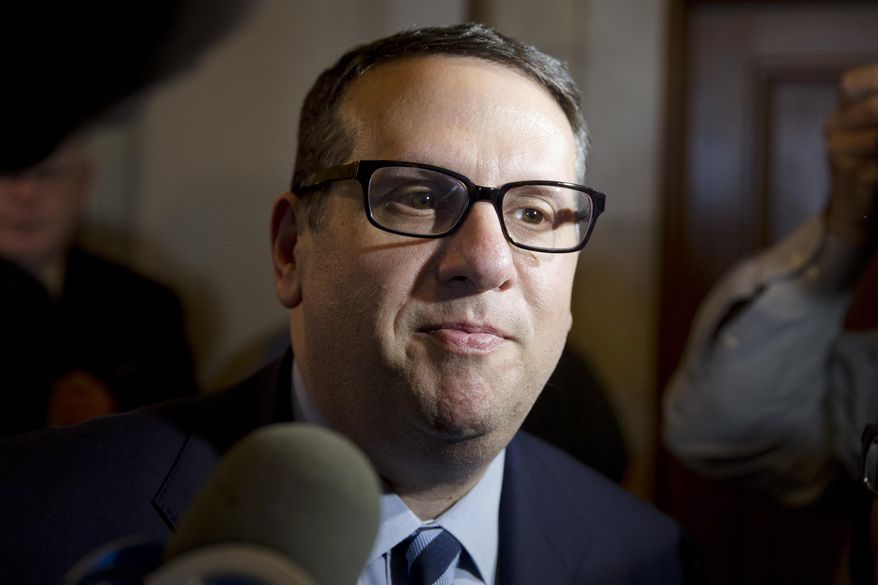 David Wildstein walks from a hearing Thursday, Jan. 9, 2014, at the Statehouse in Trenton, N.J. Wildstein, a former appointee of Gov. Chris Christie, is refusing to answer questions from a legislative committee looking into a scandal involving punitive traffic lane closures. The Christie administration stands accused of closing lanes on the George Washington Bridge, linking New York and New Jersey, in order to create a huge traffic backup as retribution against a local mayor for not endorsing the governor’s reelection. (AP Photo/Matt Rourke)