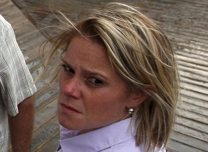 This Sept. 12, 2013 photo provided by the Office of the Governor of New Jersey shows Deputy Chief of Staff Bridget Anne Kelly during a tour with Gov. Chris Christie of the Seaside Heights, N.J. boardwalk, after it was hit by a massive fire. Christie fired Kelly Thursday, Jan. 9, 2014, and apologized over and over for his staff's "stupid" behavior, insisting during a nearly two-hour news conference that he had no idea anyone around him had engineered traffic jams as part of a political vendetta against a Democratic mayor. (AP Photo/Office of Gov. Chris Christie, Tim Larsen)