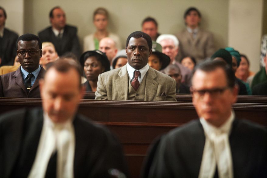 This image released by The Weinstein Company shows, Idris Elba as Nelson Mandela, center in the film, "Mandela: Long Walk to Freedom." The film was nominated for an Image Award for best motion picture on Thursday, Jan. 9, 2014. The 45th NAACP Image Awards will be held on Feb. 22. (AP Photo/The Weinstein Company, Keith Bernstein)