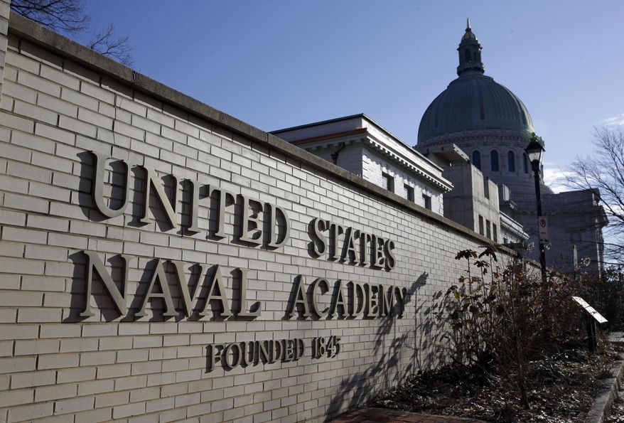A sign stands outside of an entrance to the U.S. Naval Academy campus in Annapolis, Md., on Jan. 9, 2014. A culture of bad behavior and disrespect among athletes at U.S. military academies is one part of the continuing problem of sexual assaults at the schools, according to a new Defense Department report that comes in the wake of scandals that rocked teams at all three academies last year. (Associated Press) **FILE**