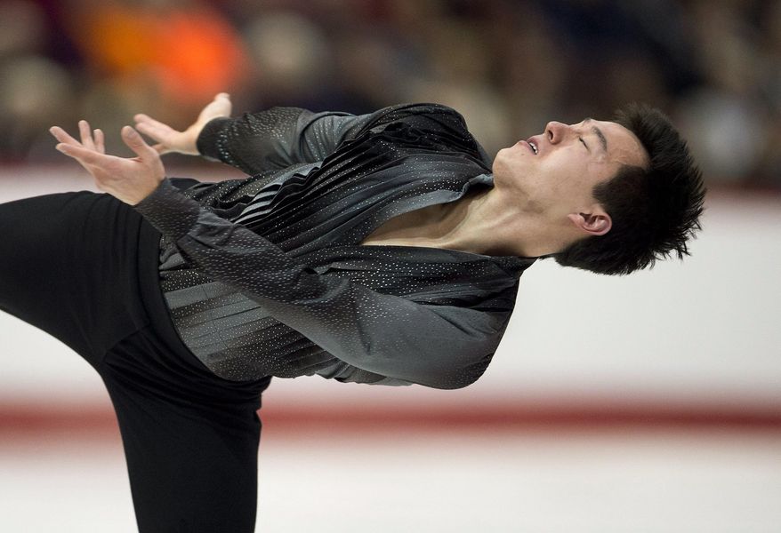 Patrick Chan performs his routine during the men's short program at the Canadian figure skating championships Friday, Jan. 10, 2014, in Ottawa, Ontario. Chan was in first place following the short program. (AP Photo/The Canadian Press, Adrian Wyld)