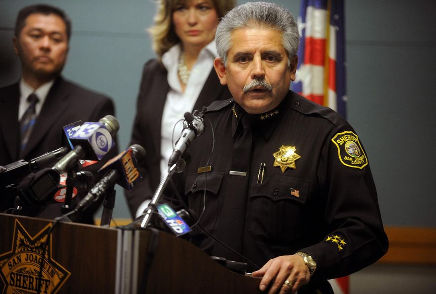 FILE -In this file photo from Friday, March 30, 2012, San Joaquin County Sheriff Steve Moore speaks during a news conference at the San Joaquin County Jail in French Camp, Calif. A federal judge in Northern California is considering an argument that Sheriff Steve Moore was negligent for using heavy machines to excavate a well for the remains of murder victims. Joan Shelley, the mother of a 16-year-old girl who is a suspected victim of serial killers Wesley Shermantine and Loren Herzog a.k.a. the notorious “Speed Freak Killers,” said the sheriff's office assured her the bodies would be exhumed with care. Shelley said in court papers she was "shocked" and "horrified" her daughter's remains were dug up with heavy machinery. Shelley and two of her daughters are suing the county and the sheriff, saying the bones of 16-year-old JoAnn Hobson were destroyed and commingled with those of other victims. (AP Photo/The Record, Michael McCollum)