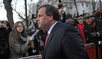 ** FILE ** In this Thursday, Jan. 9, 2014, file photo, New Jersey Gov. Chris Christie walks past reporters as he leaves City Hall, in Fort Lee, N.J., after apologizing in person to Mayor Mark Sokolich. (AP Photo/Louis Lanzano, File)