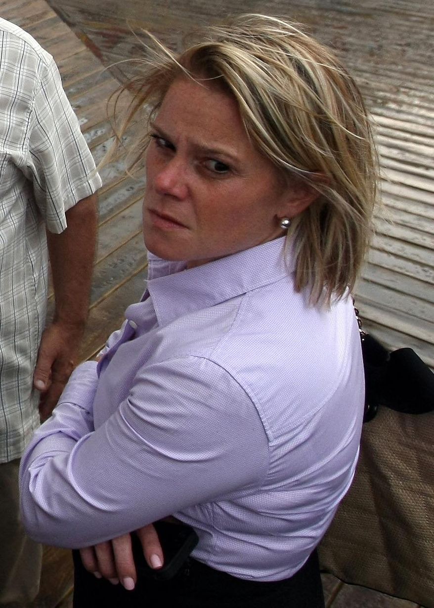 This Sept. 12, 2013 photo provided by the Office of the Governor of New Jersey shows Deputy Chief of Staff Bridget Anne Kelly during a tour with Gov. Chris Christie of the Seaside Heights, N.J. boardwalk, after it was hit by a massive fire. Christie fired Kelly Thursday, Jan. 9, 2014, and apologized over and over for his staff's "stupid" behavior, insisting during a nearly two-hour news conference that he had no idea anyone around him had engineered traffic jams as part of a political vendetta against a Democratic mayor. (AP Photo/Office of Gov. Chris Christie, Tim Larsen)