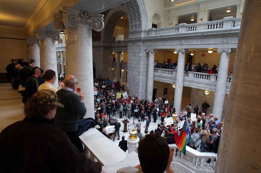 Supporters of gay marriage fill the rotunda as they gather to rally at the Utah State Capitol and deliver over 58,000 petition signatures in support of gay marriage to Utah Governor Gary Herbert January 10, 2014 in Salt Lake City.  (Photo/Steve C. Wilson)