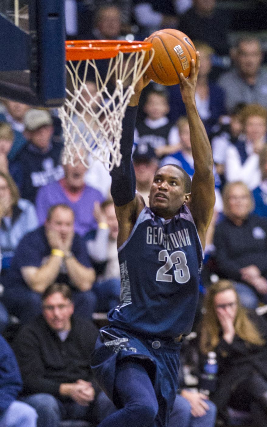 Georgetown's Aaron Bowen (23) goes to the basket for a slam dunk in overtime of an NCAA college basketball game, Saturday, Jan. 11, 2014, in Indianapolis. Georgetown defeated Butler 70-67 in overtime. (AP Photo/Doug McSchooler)
