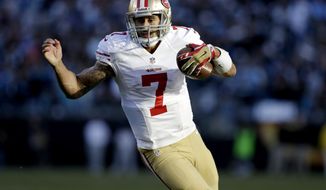 San Francisco 49ers quarterback Colin Kaepernick (7) carries the ball against the Carolina Panthers during the second half of a divisional playoff NFL football game, Sunday, Jan. 12, 2014, in Charlotte, N.C. (AP Photo/Gerry Broome)