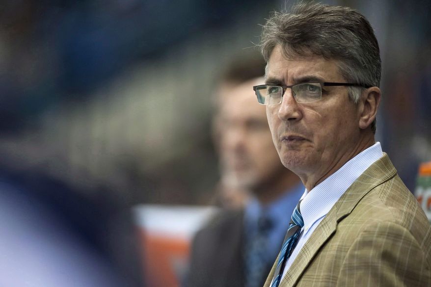 FILE - In a Sept. 27, 2013, file photo Winnipeg Jets head coach Claude Noel speaks to his team during the first period of an NHL pre-season hockey game against the Boston Bruins in Saskatoon, Saskatchewan. The Jets have fired Noel and hired Paul Maurice as his replacement. (AP Photo/The Canadian Press, Liam Richards)
