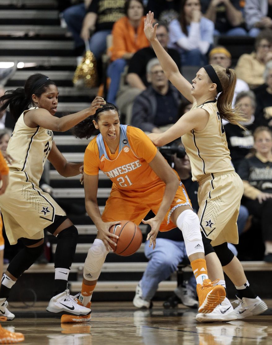 Tennessee center Mercedes Russell (21) tries to get past Vanderbilt defenders Morgan Batey, left, and Kylee Smith, right, in the first half of an NCAA college basketball game on Sunday, Jan. 12, 2014, in Nashville, Tenn. (AP Photo/Mark Humphrey)