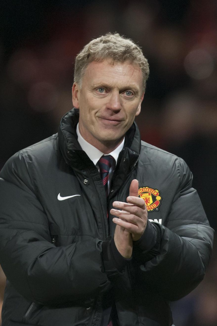 Manchester United's manager David Moyes applauds supporters after his team's 2-0 win against Swansea City in their English Premier League soccer match at Old Trafford Stadium, Manchester, England, Saturday Jan. 11, 2014. (AP Photo/Jon Super)