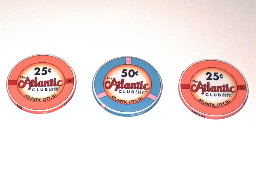 FILE - This March 13, 2012 photo shows 25 and 50-cent gambling chips at the Atlantic Club Casino Hotel in Atlantic City NJ. Competitors are already trying to lure away customers and employees of the Atlantic Club, which will shut down on Jan. 13. (AP Photo/Wayne Parry, File)
