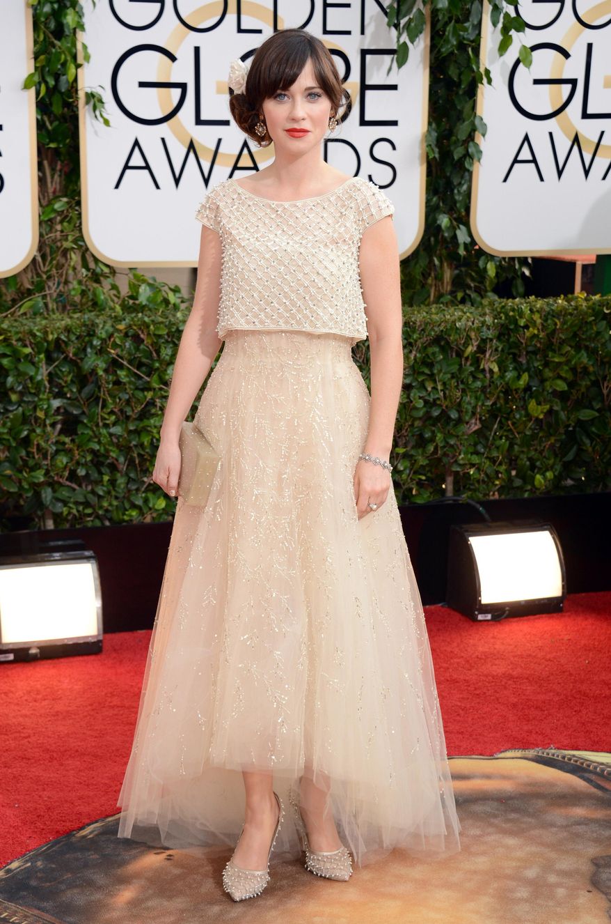 Zooey Deschanel arrives at the 71st annual Golden Globe Awards at the Beverly Hilton Hotel on Sunday, Jan. 12, 2014, in Beverly Hills, Calif. (Photo by Jordan Strauss/Invision/AP)