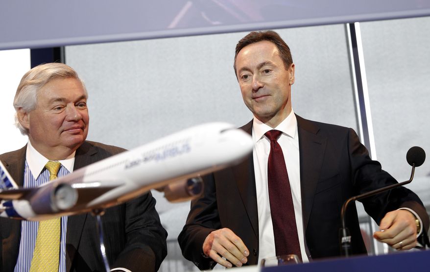 John Leahy, Chief Operating Officer Customers of Airbus, left, and Airbus CEO Fabrice Bregier, arrive for the annual news conference in Toulouse, southwestern France, Monday, Jan. 13, 2014. The European aerospace conglomerate said Monday it delivered 626 planes last year, a company record but still 22 fewer than U.S. rival Boeing Co. (AP Photo/Christophe Ena)