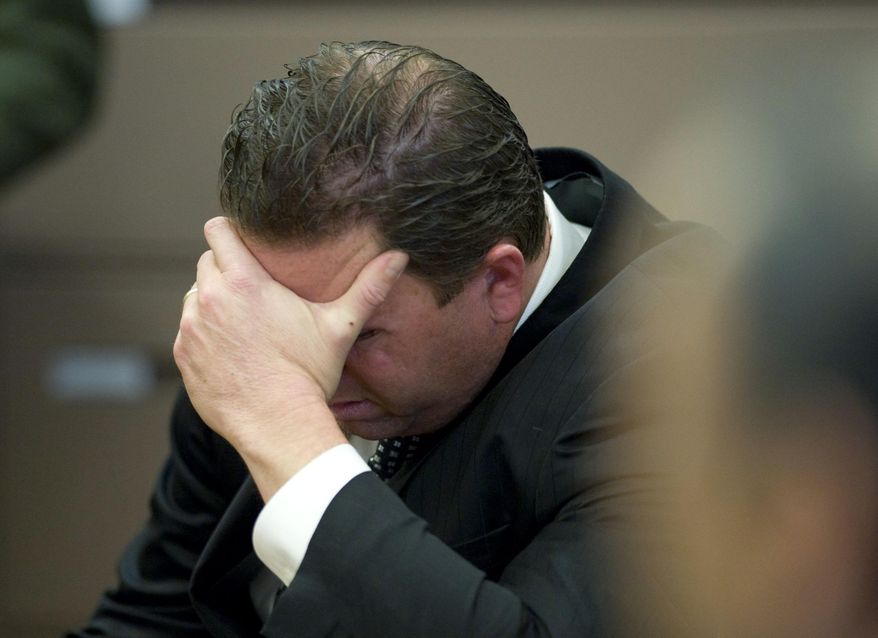 ADDS LOCATION-Former Fullerton police Officer Jay Cicinelli reacts after his acquittal Monday Jan. 13, 2014, in Santa Ana, Calif., of involuntary manslaughter and assault under color of authority for his role in the July 5, 2011, beating of transient Kelly Thomas. (AP Photo/Mindy Schauer, Pool)