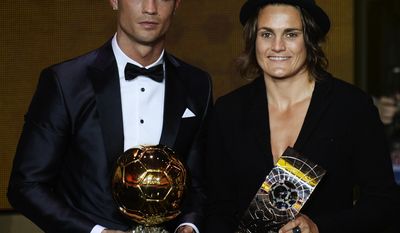 Cristiano Ronaldo of Portugal, left, and Nadine Angerer of Germany pose with their trophies after being elected FIFA Men&#39;s and Women&#39;s soccer player of the year 2013 at the FIFA Ballon d&#39;Or 2013 gala at the Kongresshaus in Zurich, Switzerland, Monday, Jan. 13, 2014. (AP Photo/Keystone, Steffen Schmidt)