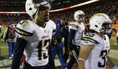 San Diego Chargers wide receiver Keenan Allen (13) and San Diego Chargers running back Danny Woodhead (39) walk off the field after the Chargers lost 24-17 to the Denver Broncos in an NFL AFC division playoff football game, Sunday, Jan. 12, 2014, in Denver. (AP Photo/Joe Mahoney)
