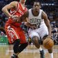Boston Celtics shooting guard Jordan Crawford, right, gets by Houston Rockets point guard Jeremy Lin (7) in the first half of an NBA basketball game in Boston, Monday, Jan. 13, 2014. (AP Photo/Elise Amendola)