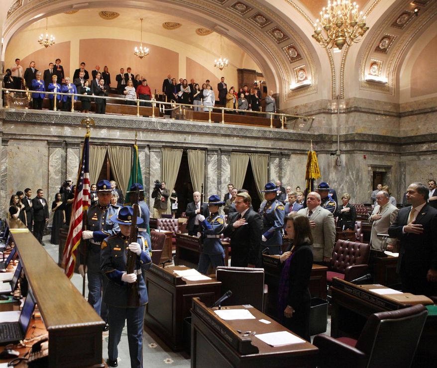 The Washington State Patrol Color Guard enters the Senate Chambers, Monday, Jan. 13, 2014, during the opening for the 2014 Legislative session in Olympia, Wash.