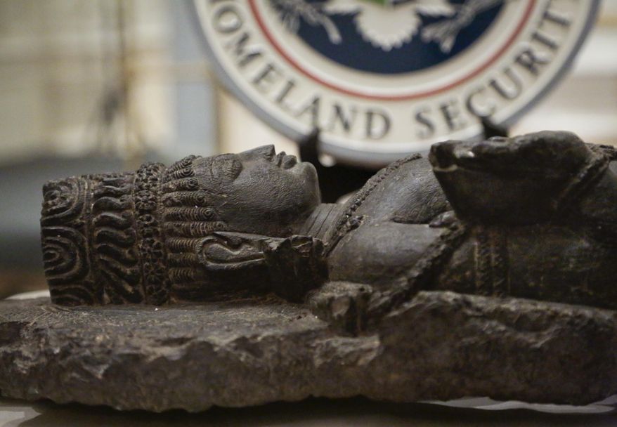 A recovered Indian antiquity is shown during a repatriation ceremony on Tuesday, Jan. 14, 2014 in New York. U.S. authorities returned three stolen antiquities to the Indian government. Homeland Security Investigations agents seized the art, valued at more than $1.5 million. (AP Photo/Bebeto Matthews)