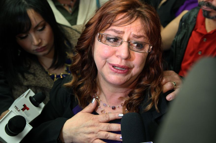 Yolanda Villegas talks to reporters after learning her son would be released from jail in El Paso, Texas, Tuesday, Jan. 14, 2014. Daniel Villegas, convicted in 1995 for the murder of two teens, was released on bond after a court of appeals ruled his defense was inefficient during the 1995 trial. (AP Photo/Juan Carlos Llorca)