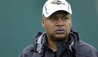 FILE - In this Jan. 30, 2013, file photo, Baltimore Ravens offensive coordinator Jim Caldwell walks onto the field as his team warms up during an NFL Super Bowl XLVII football practice in New Orleans. A person familiar with the situation says the Detroit Lions have hired coach Caldwell. (AP Photo/Patrick Semansky, File)