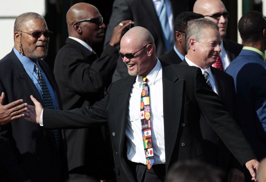 FILE - In this Oct. 7, 2011, file photo, Former Bears quarterback Jim McMahon, celebrates on stage after taking part in a ceremony honoring the 1985 Super Bowl XX Champions Chicago Bears football team, hosted by President Barack Obama, on the South Lawn of the White House in Washington. McMahon is one of more than 4,500 former players that have filed suit, some accusing the NFL football league of fraud for its handling of concussions. A federal judge on Tuesday, Jan. 14, 2014, denied preliminary approval of a $765 million settlement of NFL concussion claims, fearing it may not be enough to cover 20,000 retired players. (AP Photo/Pablo Martinez Monsivais, File)