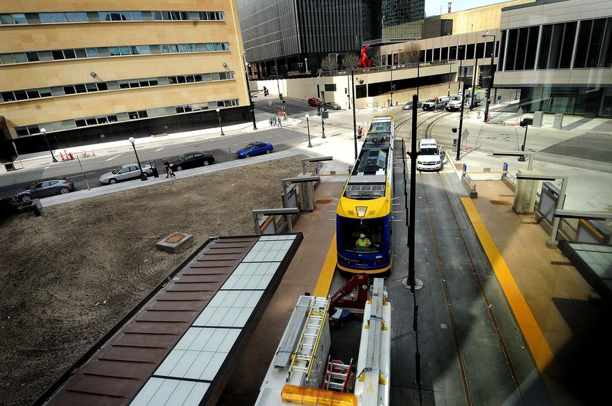 FILE - In this April 28, 2013 file photo the first light rail train car, not yet running on its own power, is pulled into the central station during its inaugural run on the Central Corridor Green Line in St. Paul, Minn. Gov. Mark Dayton, speaking on construction project wishes Wednesday, Jan. 15, 2014, chose not to include any funding for the next hoped-for leg in the Minneapolis-St. Paul light rail system, connecting downtown Minneapolis to western suburbs. (AP Photo/St. Paul Pioneer Press, Sherri LaRose-Chiglo, File)
