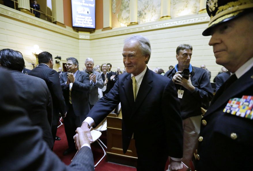 Rhode Island Gov. Lincoln Chafee, center, greets people on the floor of the House Chamber before delivering his State of the State address at the Statehouse, Wednesday, Jan. 15, 2014 in Providence. The annual speech traditionally sets out a governor's priorities for the year. It is Chafee's fourth and final such address. (AP Photo/Steven Senne)
