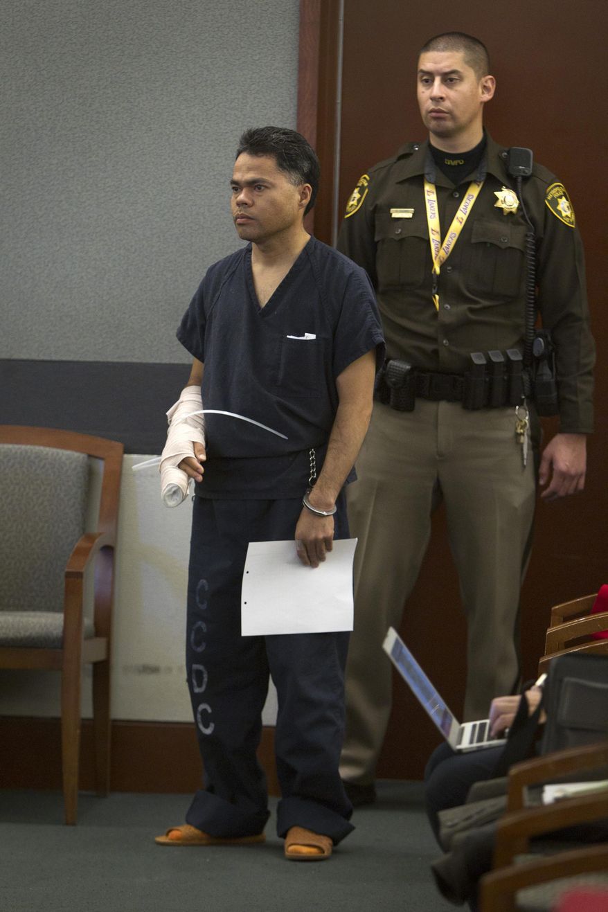 Richard Magdayo Dahan appears in court at the Regional Justice Center in Las Vegas Wednesday, Jan. 15, 2014. Dahan, 40, is accused of killing his 28-year-old wife, Daisy Casalta Dahan. Las Vegas Justice of the Peace Deborah Lippis delayed Dahan's initial appearance to Thursday to obtain a Tagalog language interpreter. (AP Photo/Las Vegas Sun, Steve Marcus)