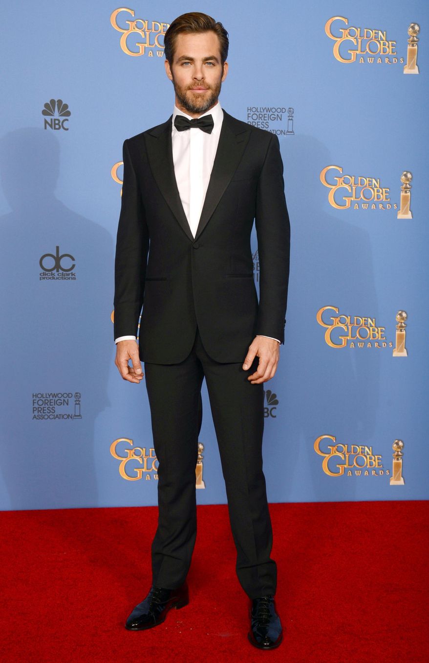 FILE - In this Sunday, Jan. 12, 2014 file photo, actor Chris Pine poses in the press room at the 71st annual Golden Globe Awards at the Beverly Hilton Hotel, in Beverly Hills, Calif. Pine says the US should have done more in the run-up to the Olympics to protest Russia’s anti-gay legislation, which he calls “clearly awful, archaic, hostile nonsense.” “I think we should do more than just send gay Olympians there,” he said in an interview while promoting his film “Jack Ryan: Shadow Recruit," which opens Friday, Jan. 17, 2014. (Photo by Jordan Strauss/Invision/AP)