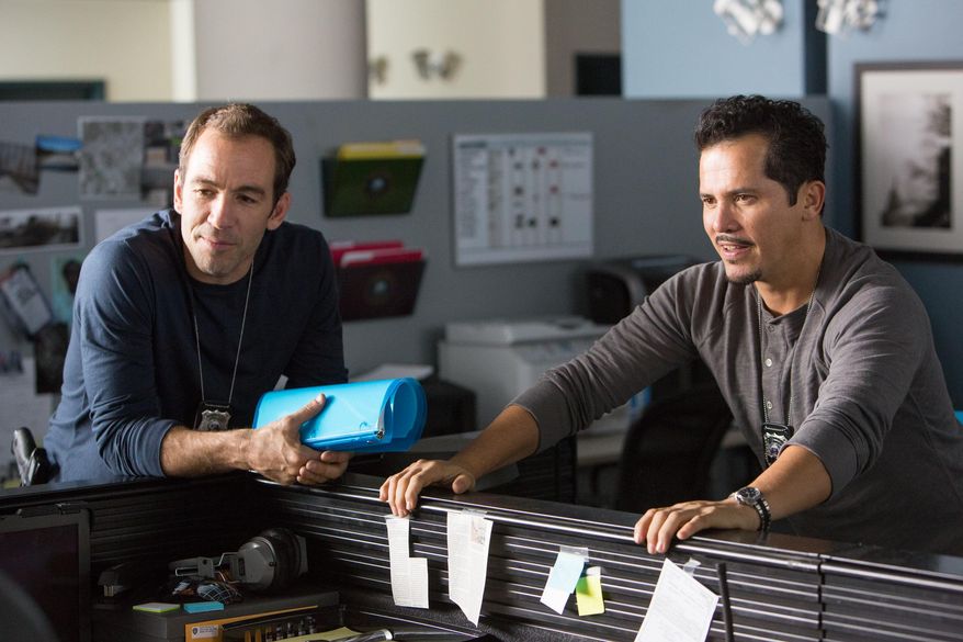 This image released by Universal Pictures shows Bryan Callen, left, and John Leguizamo in a scene from "Ride Along." (AP Photo/Universal Pictures, Quantrell D. Colbert)