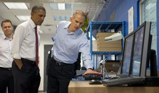 President Barack Obama tours Vacon, a research and development center and lab for high-power AC drives, with Vacon Vice President Dan Isaksson, left, and Vacon engineer Rod Washington, right, Wednesday, Jan. 15, 2014, in Durham, N.C., before traveling to North Carolina State University where he will speak about the economy, jobs and manufacturing.  (AP Photo/Carolyn Kaster) **FILE**