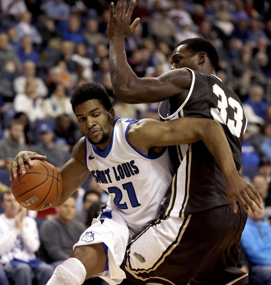 Saint Louis' Dwayne Evans, left, tries to find his way around St. Bonaventure's Marquise Simmons during the first half of an NCAA college basketball game Wednesday, Jan. 15, 2014, in St. Louis. (AP Photo/Jeff Roberson)