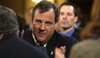 In this Tuesday, Jan. 14, 2014 file photo, New Jersey Gov. Chris Christie arrives to deliver his State Of The State address at the Statehouse in Trenton, N.J. Christie, eager to get on with business amid a scandal over traffic jams that appear to have manufactured by aides, is meeting Thursday morning, Jan. 16, 2014, with homeowners affected by Superstorm Sandy even as the Legislature prepares to issue new subpoenas as part of its investigation. (AP Photo/Julio Cortez, File)