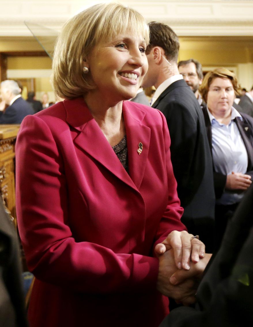 New Jersey Lt. Gov. Kim Guadagno arrives at the Statehouse for Gov. Chris Christie State Of The State address, Tuesday, Jan. 14, 2014, in Trenton, N.J. (AP Photo/Julio Cortez)