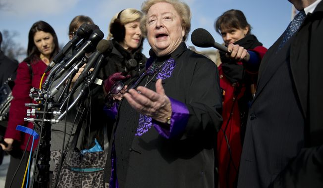 Eleanor McCullen, who sued the state of Massachusetts for enacting a buffer zone around Planned Parenthood clinics claiming it limits their ability to encounter patients arriving for care, speaks with reporters outside the Supreme Court in Washington, Wednesday, Jan. 15, 2014, after the court heard arguments on a state of Massachusetts law setting a 35-foot (10 meter) protest-free zone outside abortion clinics.  (AP Photo/ Evan Vucci)   