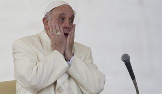 Pope Francis touches his face during his weekly general audience, in St. Peter&#39;s Square, at the Vatican, Wednesday, Jan. 15, 2014. (AP Photo/Andrew Medichini)