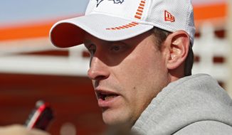 Denver Broncos offensive coordinator Adam Gase speaks to reporters after NFL football practice in Englewood, Colo., on Thursday, Jan. 16, 2014. The Broncos are scheduled to play the New England Patriots on Sunday for the AFC championship. (AP Photo/Ed Andrieski)