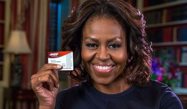 First lady Michelle Obama tweeted a photo of herself Friday holding her new AARP card on her 50th birthday.