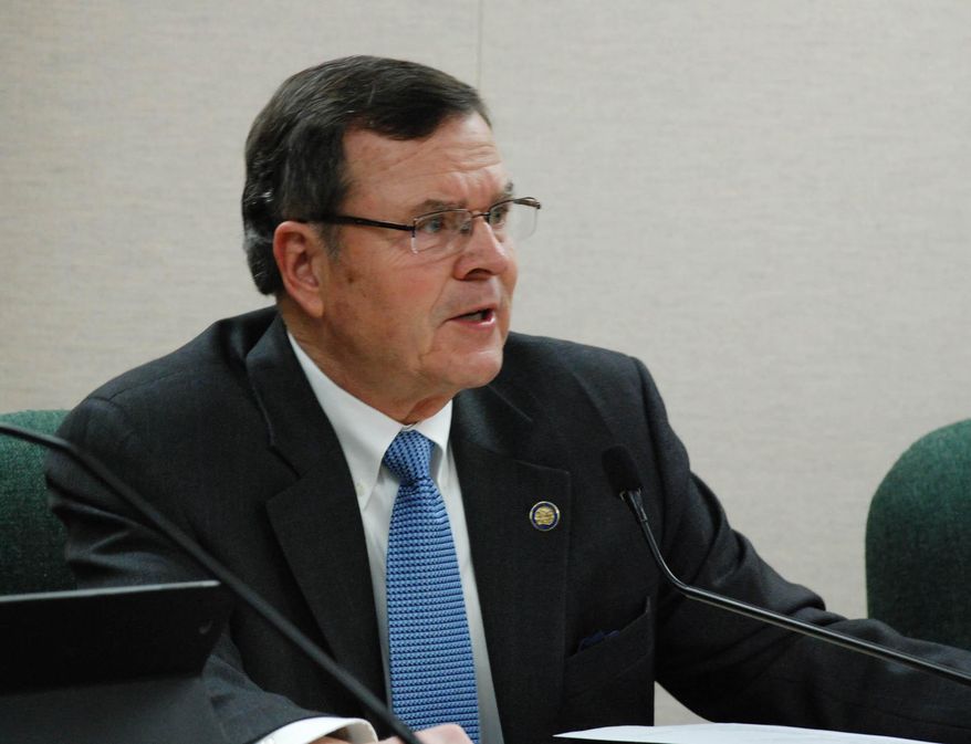 Sen. Mike Vehle, R-Mitchell, presides over the South Dakota Senate Transportation Committee on Wednesday, Jan. 15, 2014, in Pierre, S.D. Vehle will try again this year to get the South Dakota Legislature to pass a ban on texting while driving. (AP Photo/Chet Brokaw)