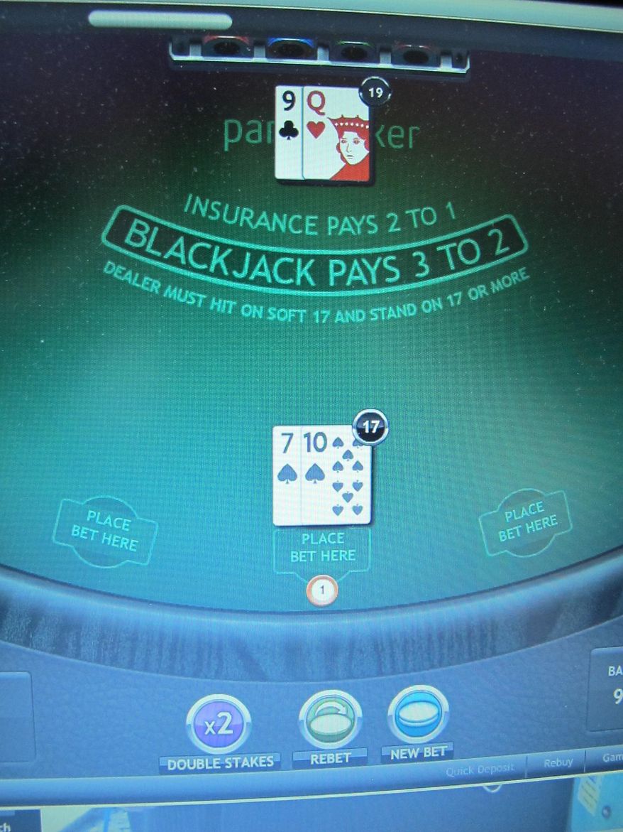 This Nov. 29, 2013 photo shows a game of Internet blackjack under way on a computer screen in Atlantic City NJ. Internet gambling got off to a slow start in New Jersey, taking in $8.4 million over the last few weeks of 2013, but casino executives and Wall Street analysts expect it to pick up steam in 2014. (AP Photo/Wayne Parry)