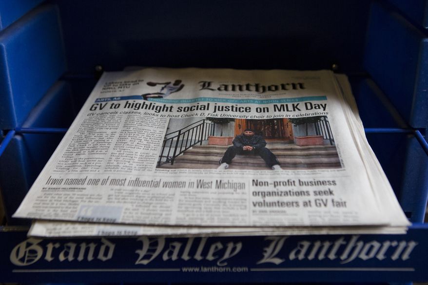Copies of the Lanthorn sit on a stand in the Kirkhof Center at Grand Valley State University on Friday, Jan. 17, 2014. The student-run newspaper has caused a stir on campus after questioning the university's policy of naming rooms and buildings after donors. (AP Photo/ MLive.com, Lauren Petracca)