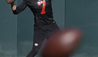 San Francisco 49ers quarterback Colin Kaepernick passes during NFL football practice in Santa Clara, Calif., Thursday, Jan. 16, 2014. The 49ers are scheduled to play the Seattle Seahawks for the NFC championship on Sunday. (AP Photo/Ben Margot)