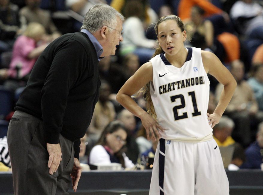 In this Nov. 24, 2013 photo, Chattanooga head coach Jim Foster talks with guard Alex Black (21) during an NCAA college basketball game in Chattanooga, Tenn. Chattanooga may not be nationally recognized as a women's college basketball power, but its 32-game home winning streak is the longest in the game, and includes wins over Southeastern Conference programs Tennessee, Auburn and Alabama. (AP Photo/, Chattanooga Times Free Press, C. B. Schmelter) THE DAILY CITIZEN OUT; NOOGA.COM OUT; CLEVELAND DAILY BANNER OUT; LOCAL INTERNET OUT