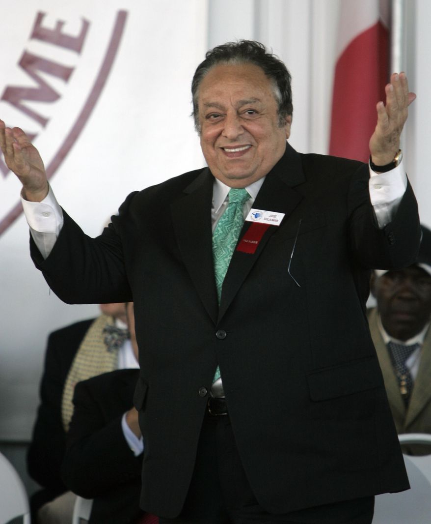 FILE - In this June, 10, 2007 file photo Jose Sulaiman, president of the World Boxing Council, acknowledges the crowd as he is inducted into the International Boxing Hall of Fame in Canastota, N.Y., Sunday, June 10, 2007. Sulaiman's son, Mauricio Sulaiman, said his father died Thursday Jan. 16, 2014, at a hospital in Los Angeles. He had been hospitalized for months for a heart condition. (AP Photo/Mike Groll, File)