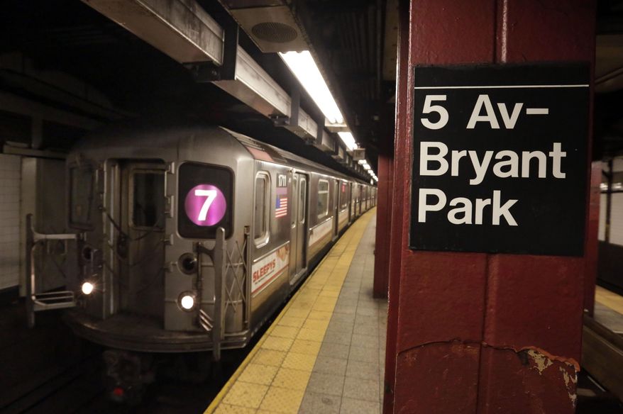 In this Dec. 4, 2013 photo, a #7 New York City subway train arrives in the 5th Avenue-Bryant Park station, in New York. Noise from screeching subway trains can be overwhelming, sometimes rising up out of the caverns trains operate in and into the buildings above. (AP Photo/Richard Drew)