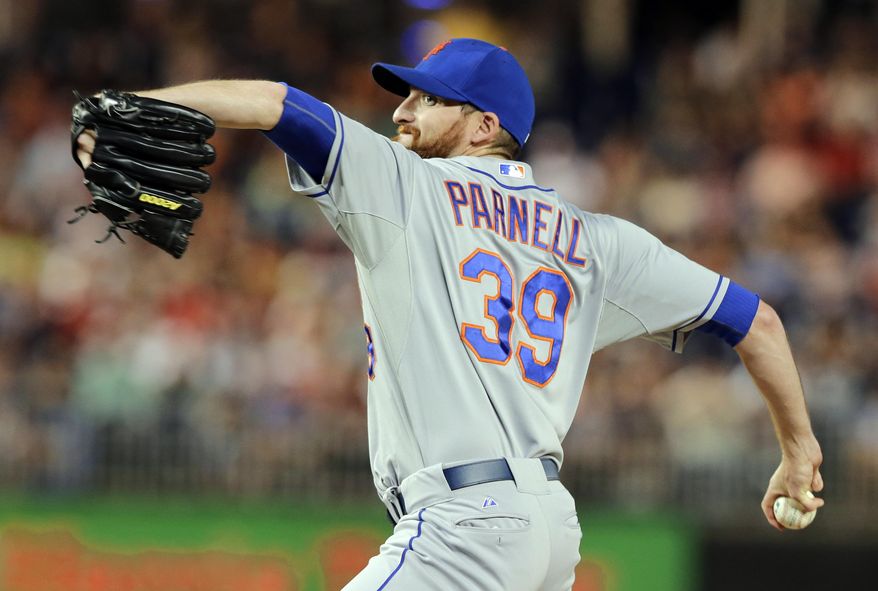 FILE - In this June 4, 2013, file photo, New York Mets relief pitcher Bobby Parnell throws during a baseball game against the Washington Nationals at Nationals Park in Washington. Parnell is ready to resume his role as the closer for the Mets. Parnell didn't pitch after July 30 and had surgery Sept. 10 to repair a herniated disk in his neck. He has been working out in Florida. (AP Photo/Alex Brandon, File)