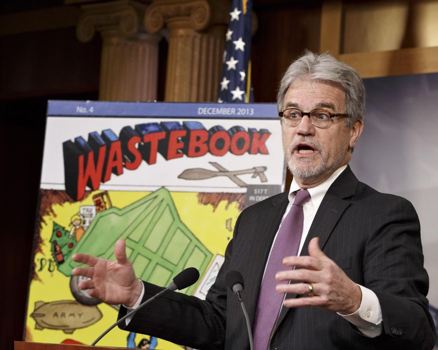 FILE - In this Dec. 17, 2013 file photo, Sen. Tom Coburn, R-Okla., a longtime deficit hawk, outlines his annual “Wastebook,” which points a critical finger at billions of dollars in questionable government spending during a news conference on Capitol Hill in Washington. U.S. Sen. Tom Coburn says he plans to finish the current year in office and resign his seat nearly two years before his term is scheduled to end. The 66-year-old Coburn released a statement late Thursday, Jan. 16, 2014  saying he would give up his seat at the end of the current session of Congress, scheduled to end in January 2015.(AP Photo/J. Scott Applewhite, File)