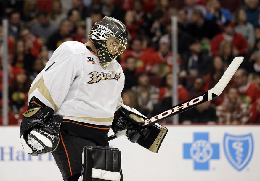 Anaheim Ducks goalie Jonas Hiller looks down as he skates to the bench during the second period of an NHL hockey game against the Chicago Blackhawks in Chicago, Friday, Jan. 17, 2014. (AP Photo/Nam Y. Huh)