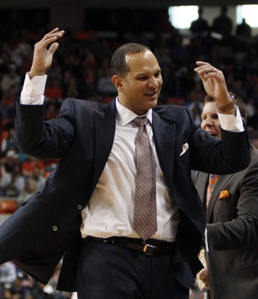Auburn coach Tony Barbee throws his hands up during the second half against Florida in an NCAA college basketball game in Auburn, Ala., Saturday, Jan. 18, 2014. (AP Photo/Jay Sailors)